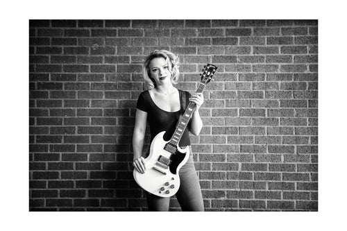 Samantha Fish posing for me while I made portraits for my Six String Slingers project to benefit The Roots of Music program in New Orleans. *50% OF THE PROFITS FROM THIS IMAGE GO TO THE ROOTS OF MUSIC PROGRAM WHICH HELPS TEACH CHILDREN IN NEW ORLEANS HOW TO BE PART OF A MARCHING BAND. IN ADDITION IT OFFERS TUTORING AND A MEAL.