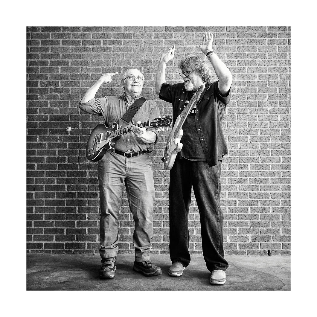 Camile Baudoin & Dave Malone of The Radiators joking around for me while I made portraits for my Six String Slingers project to benefit The Roots of Music program in New Orleans. *50% OF THE PROFITS FROM THIS IMAGE GO TO THE ROOTS OF MUSIC PROGRAM WHICH HELPS TEACH CHILDREN IN NEW ORLEANS HOW TO BE PART OF A MARCHING BAND. IN ADDITION IT OFFERS TUTORING AND A MEAL.